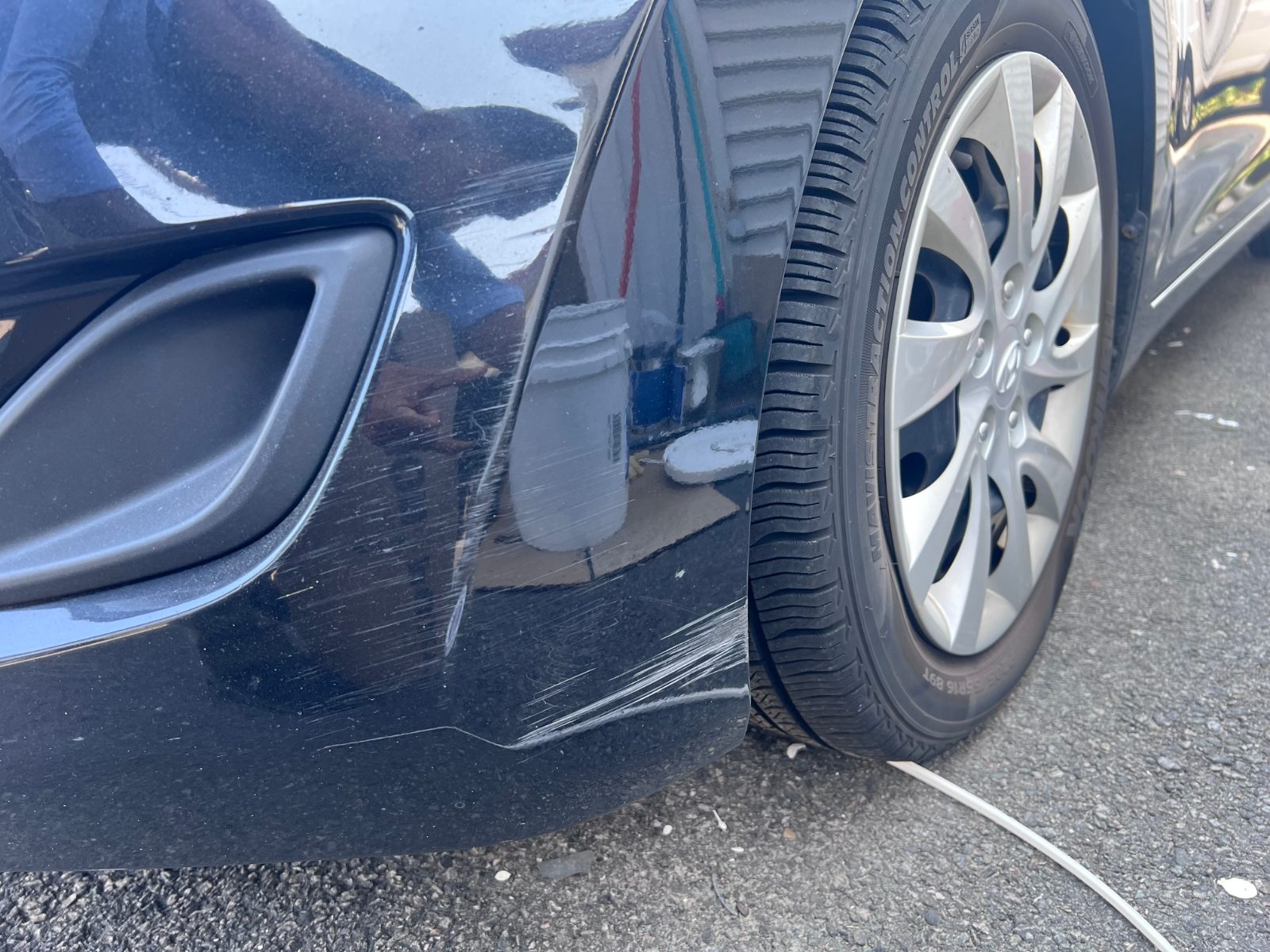 Driver front bumper.